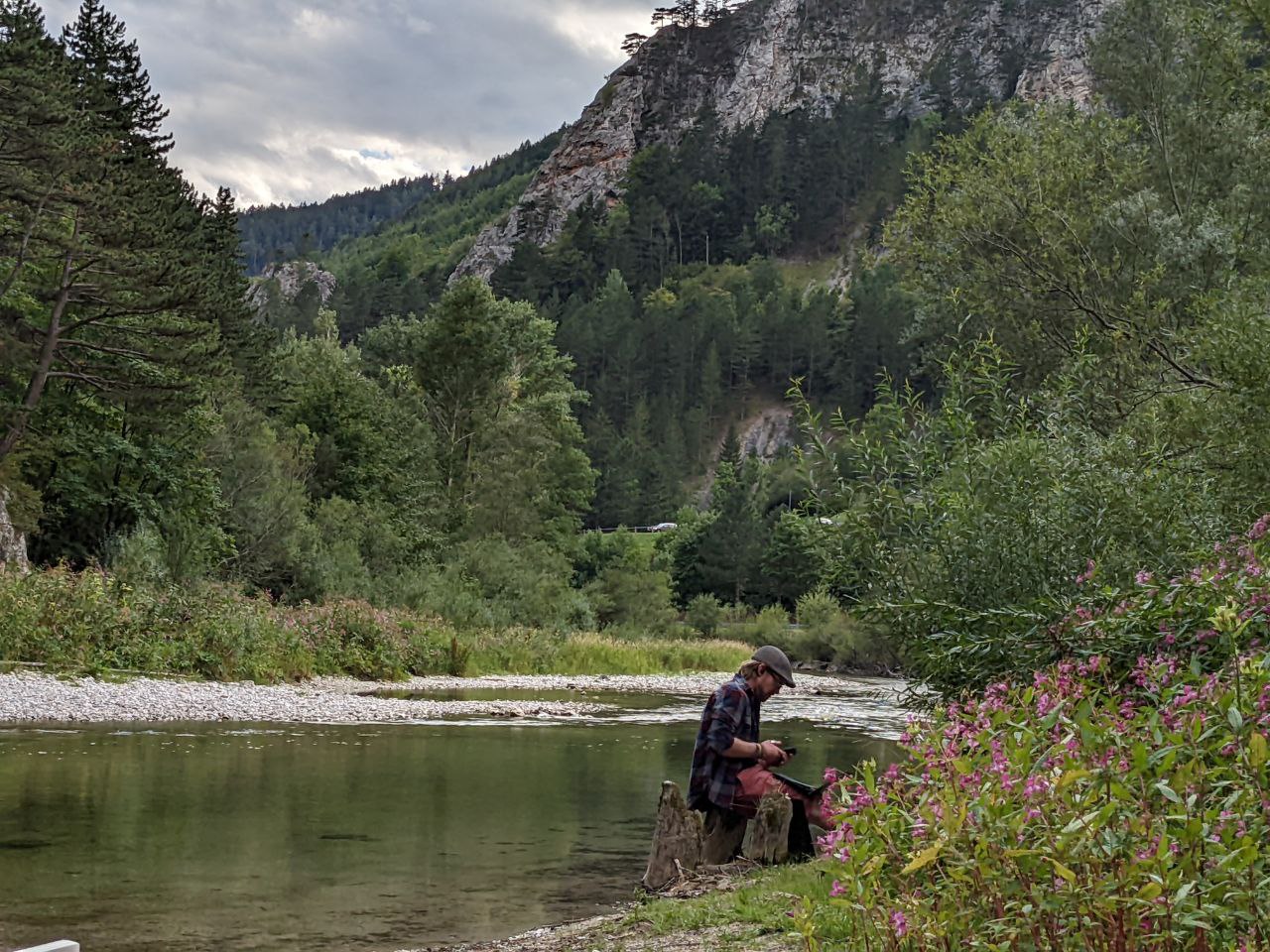 Person sitting by the river